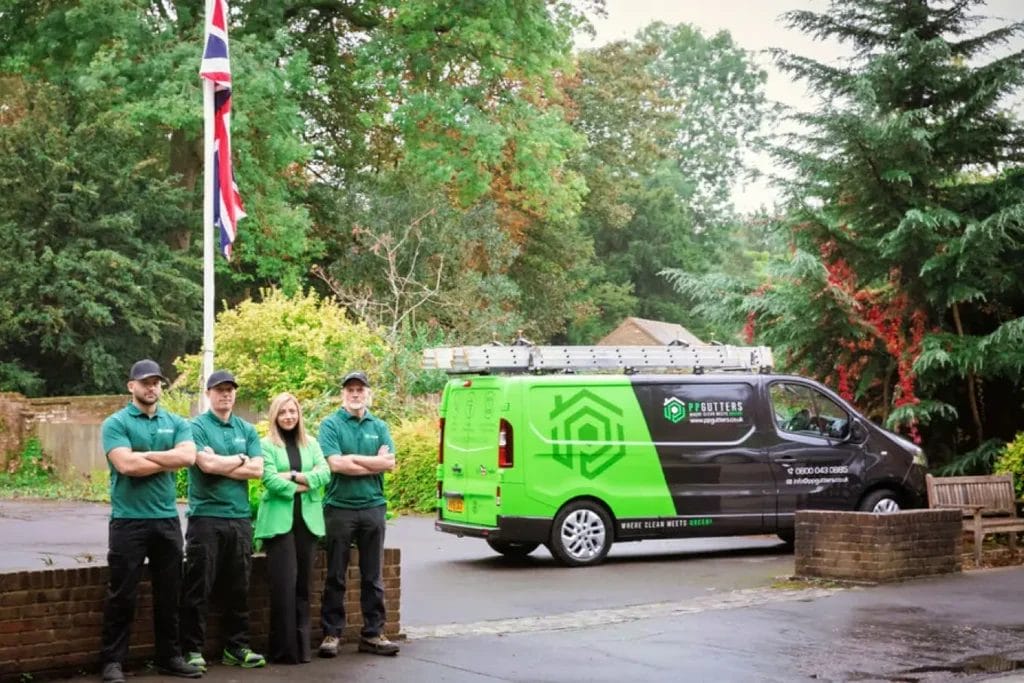 PP Gutters. The gutter and roof cleaning professionals. Team photo with company van