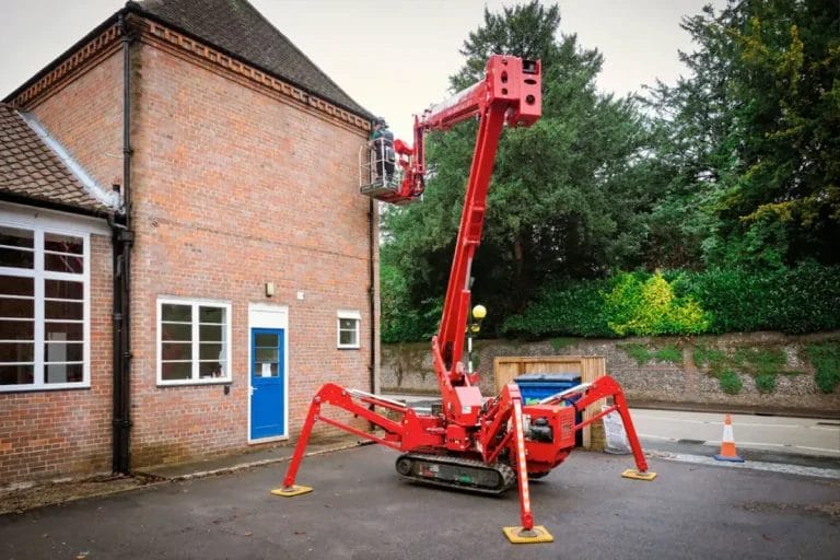 PP Gutters, cleaning a commercial property's gutters from a cherry picker, in West Wycombe
