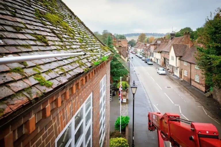 PP Gutters, cleaning a commercial property's gutters from a cherry picker, in West Wycombe