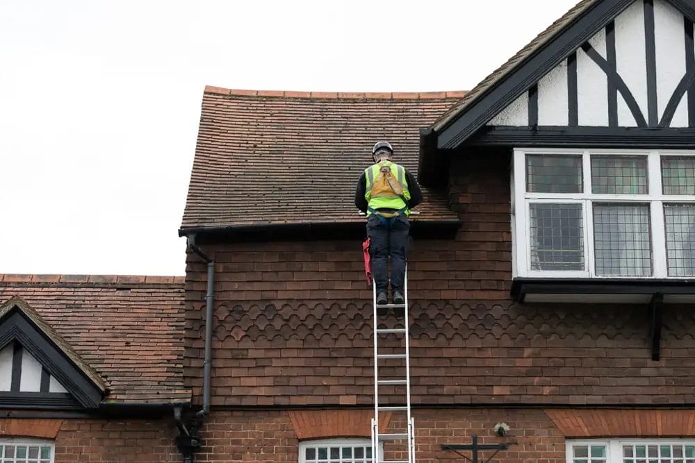 Commercial, Residential and Domestic gutter cleaning and maintenance. Photo is PP Gutters team working on a nursing home in Wooburn