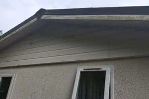 PP Gutters residential roof and gutter cleaning services. A residential property's fascias before being cleaned.
