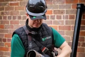 PP Gutters residential roof and gutter cleaning services. A down-pipe being replaced by PP Gutters.