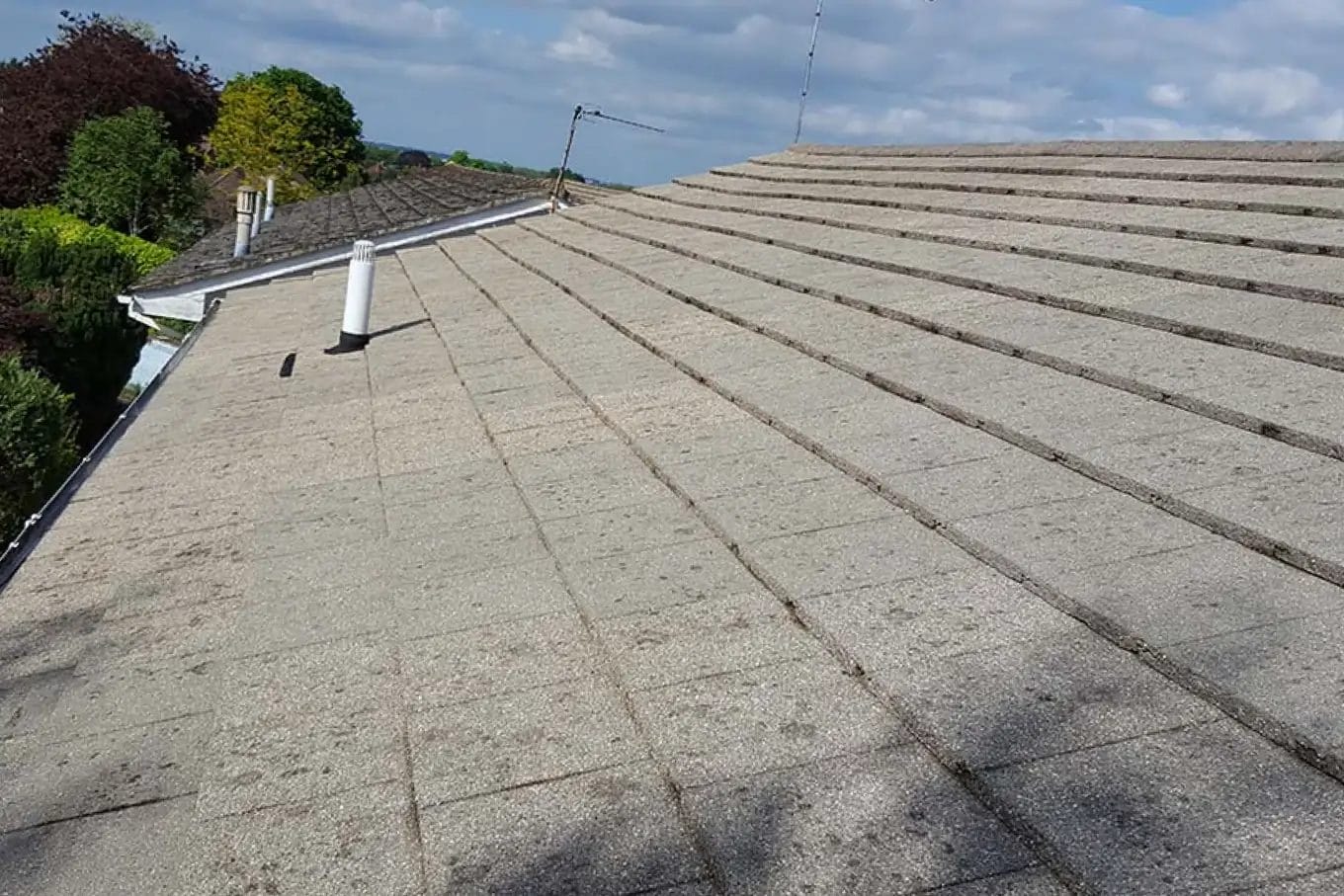 PP Gutters residential roof and gutter cleaning services. A residential property's roof after being clean.