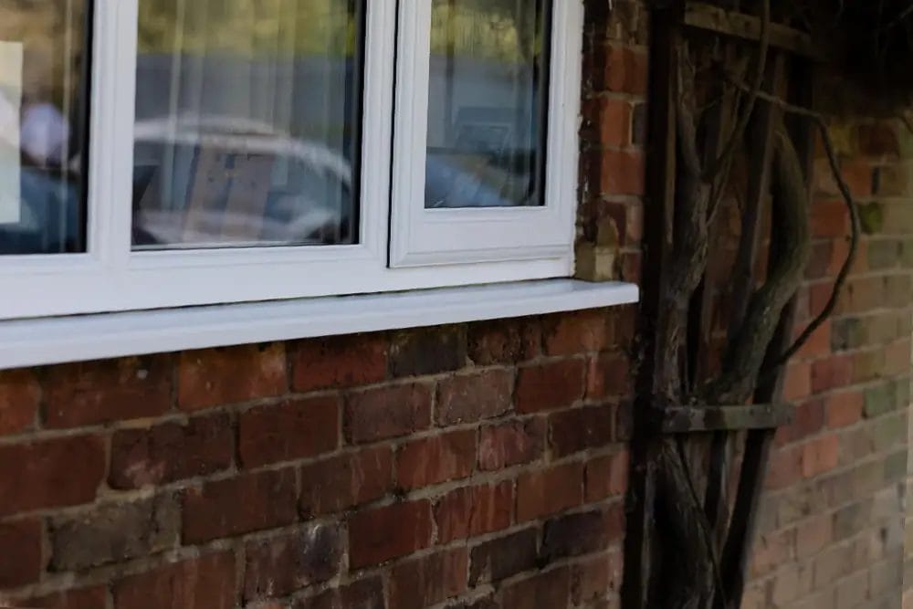 PP Gutters residential and commercial roof and gutter cleaning services. After softwashing a residential uPVC window.