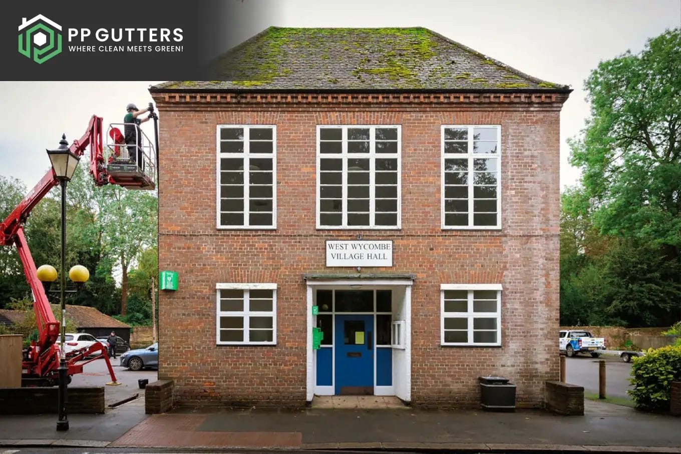 PP Gutters roof and gutter cleaning services. Gutter repairs to a commercial building using a cherry picker