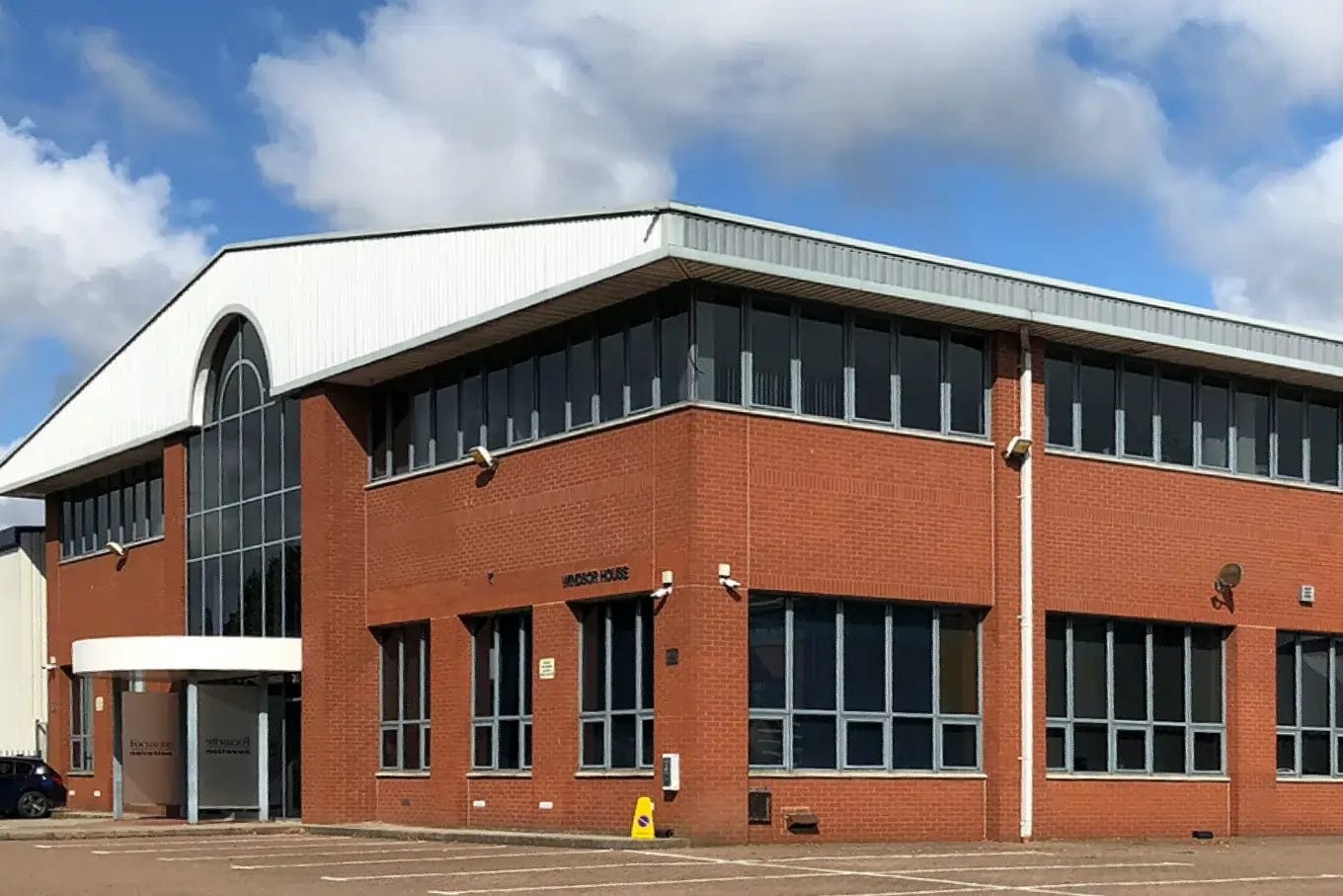 PP Gutters commercial roof and gutter cleaning services. Large commercial building