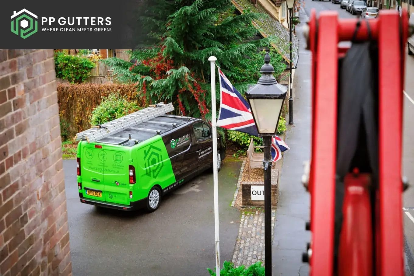 PP Gutters roof and gutter cleaning services. View of company van from cherry picker.