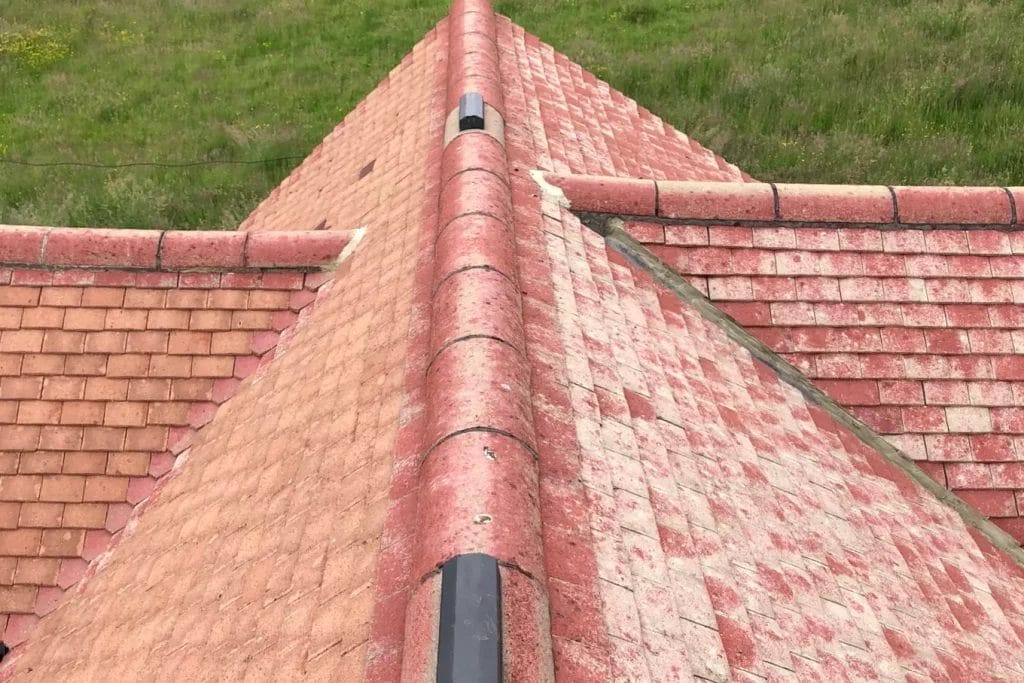 Commercial roof cleaning in London, Watford and High Wycombe - photo of a roof looking new after it's been cleared of moss by PP Gutters.