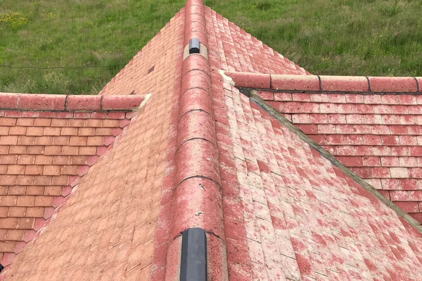 Commercial roof cleaning in London, Watford and High Wycombe - photo of a roof looking new after it's been cleared of moss by PP Gutters.