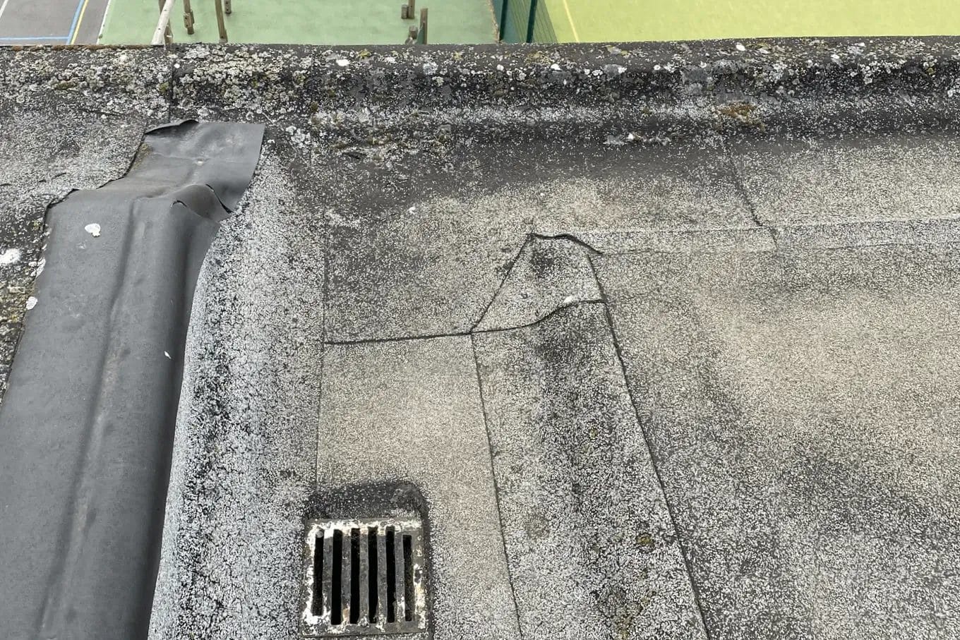 School gutter cleaning in London, Watford and High Wycombe - photo of a flat roof and gutter at Mote School in Fulham, after it's been cleared of debris by PP Gutters.